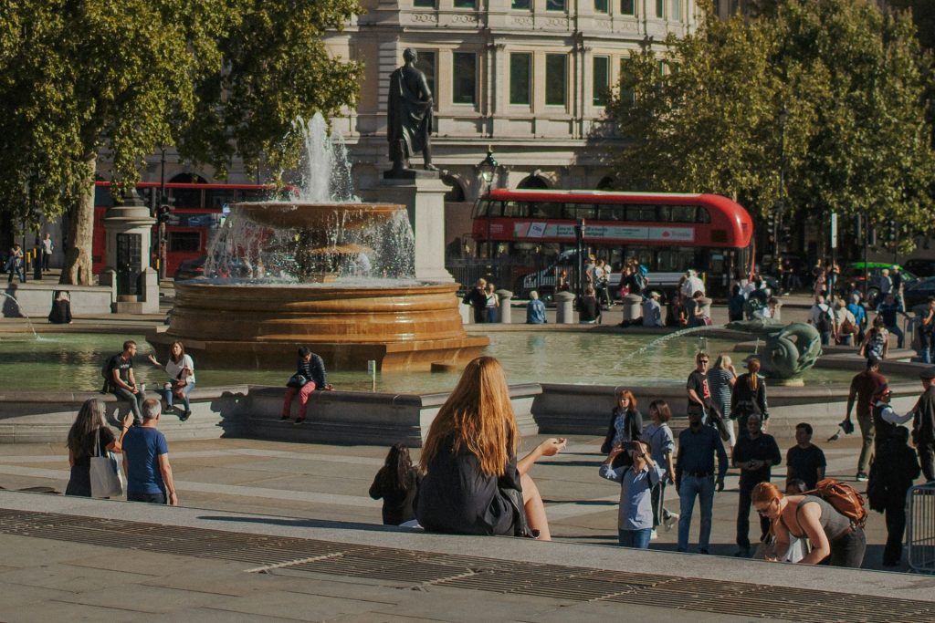 Londoners seek relief from the urban heat near a fountain (photo by Hoyoung Choi, 2019 via Unsplash)